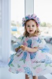 Детское нарядное платье Лори в цветочный принт с голубым бантом